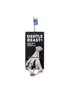 Metal dog collar on a black card with 'Gentle Beast' branding on a white background