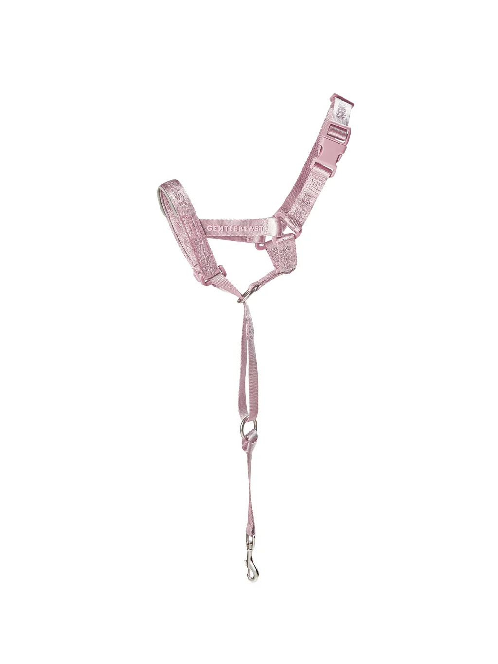 Pink dog harness and leash set on a white background