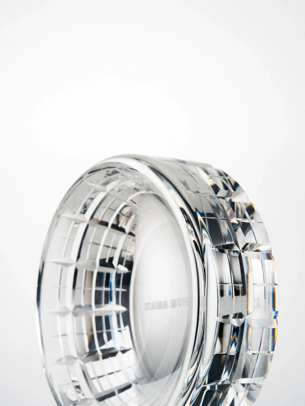 Layered cut details of a K9 crystal bowl, emphasizing depth, symmetry, and fine craftsmanship