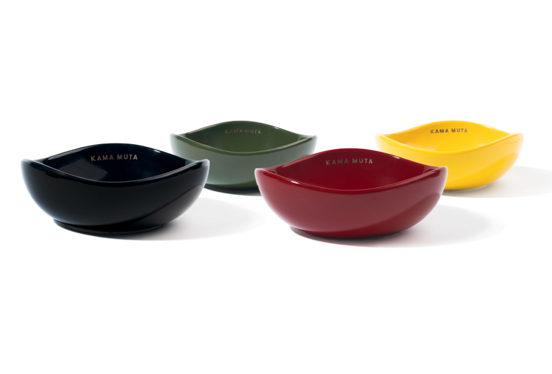 Four colorful ceramic bowls on a white background