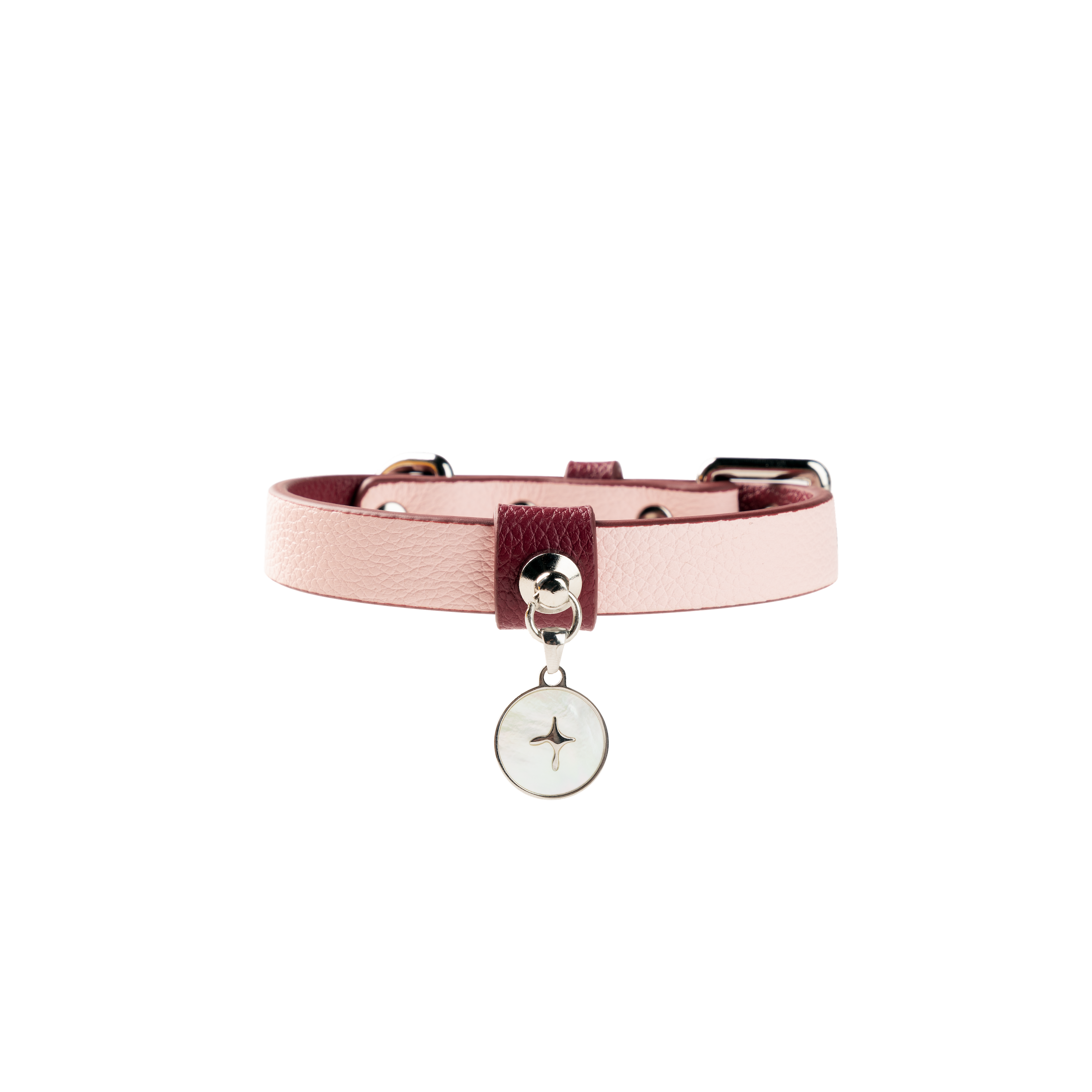 Pink leather dog collar laid flat, highlighting adjustable length and polished metal hardware