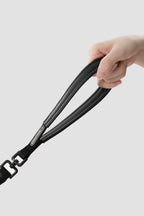 Hand holding the padded leather handle of a slip dog leash, showing comfortable grip for dog training and daily walks.
