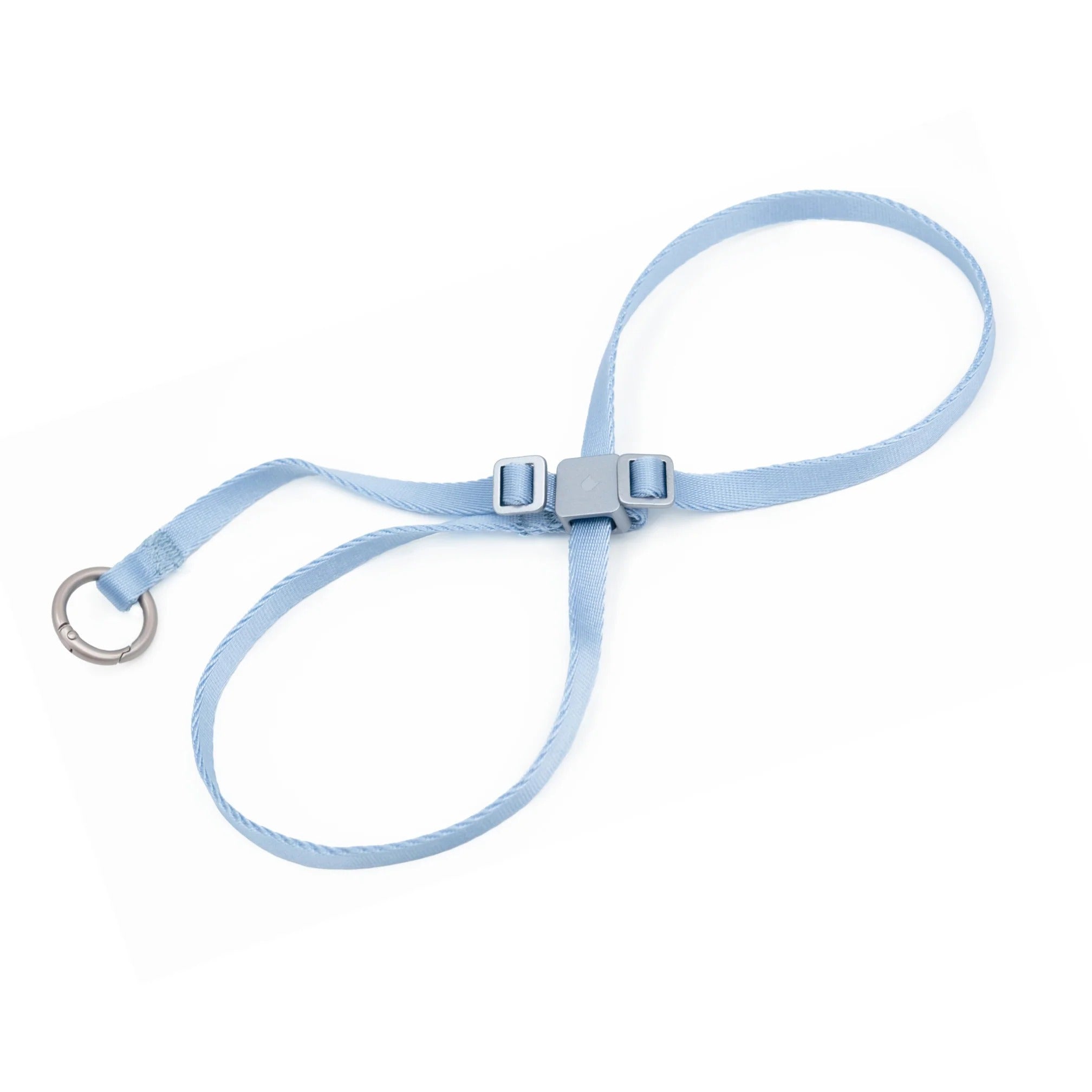 Light blue cat harness with square buckle, adjustable strap buckles, and metal ring on white background