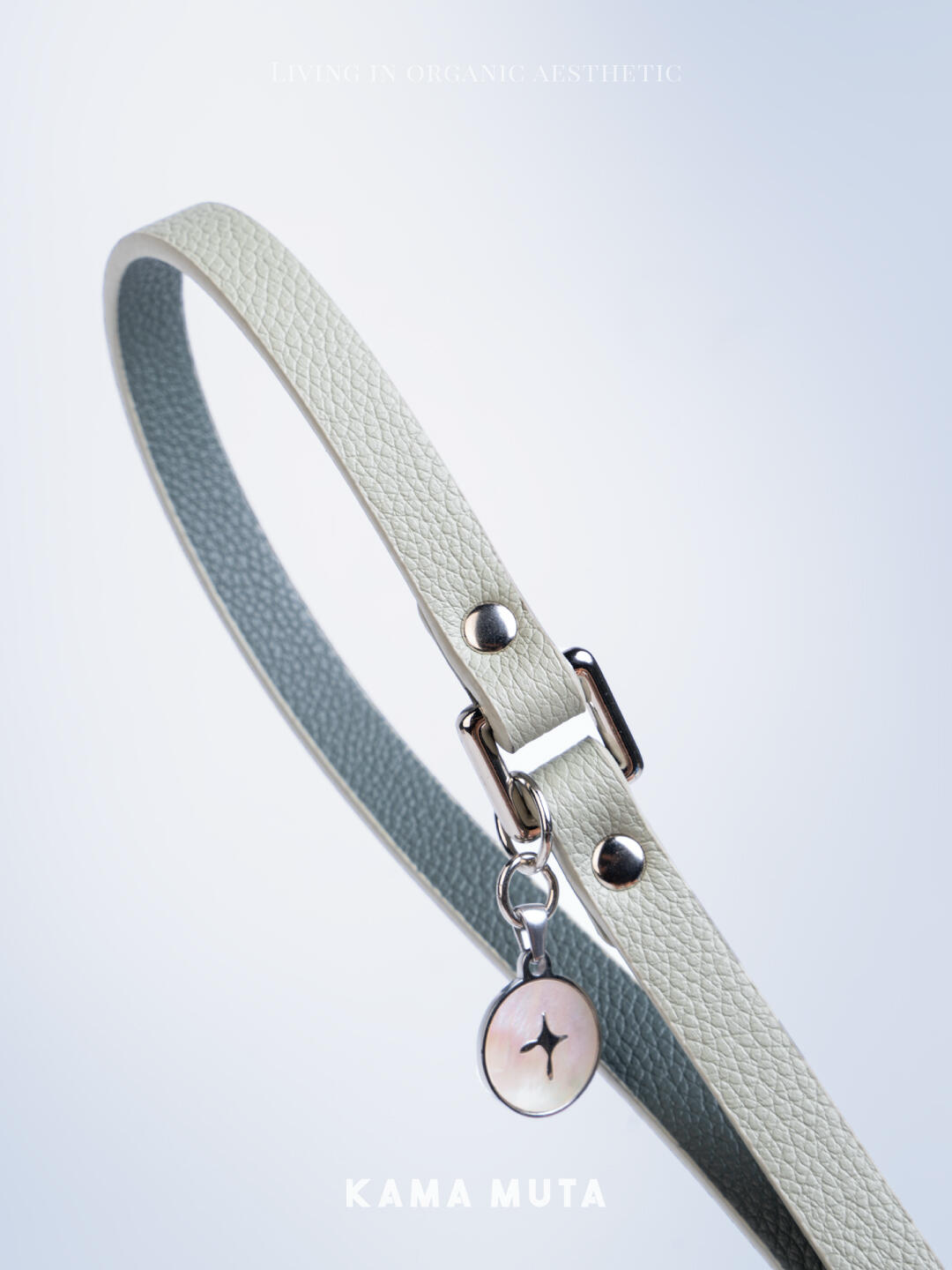 Close-up of litchi grain leather texture on an eco friendly dog leash with subtle metal accents