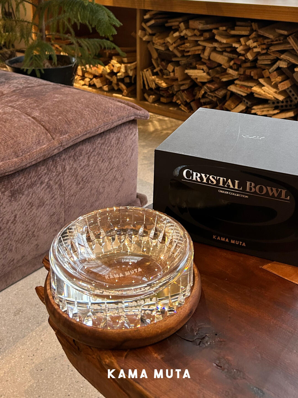 Luxury crystal pet bowl displayed with its packaging box on a wooden surface