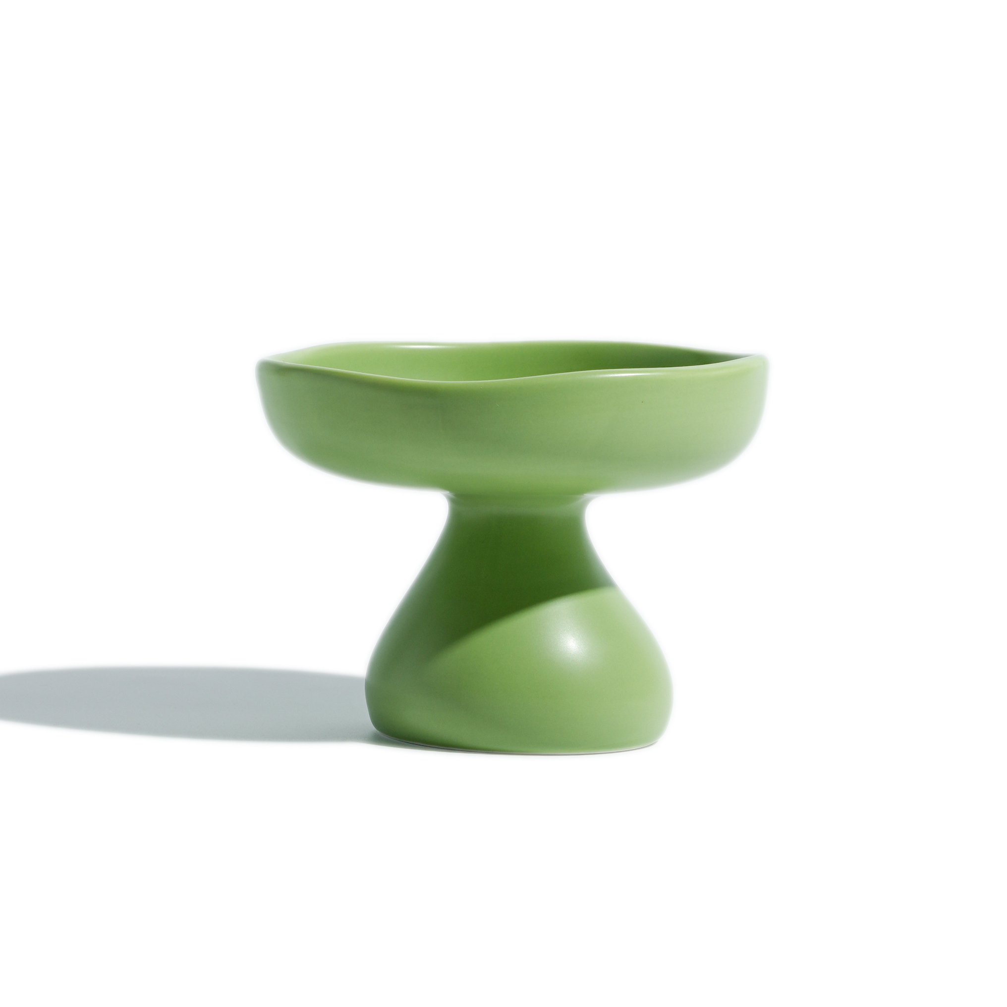 Green mushroom-shape elevated ceramic cat bowl featuring a wide rim and stable raised design.
