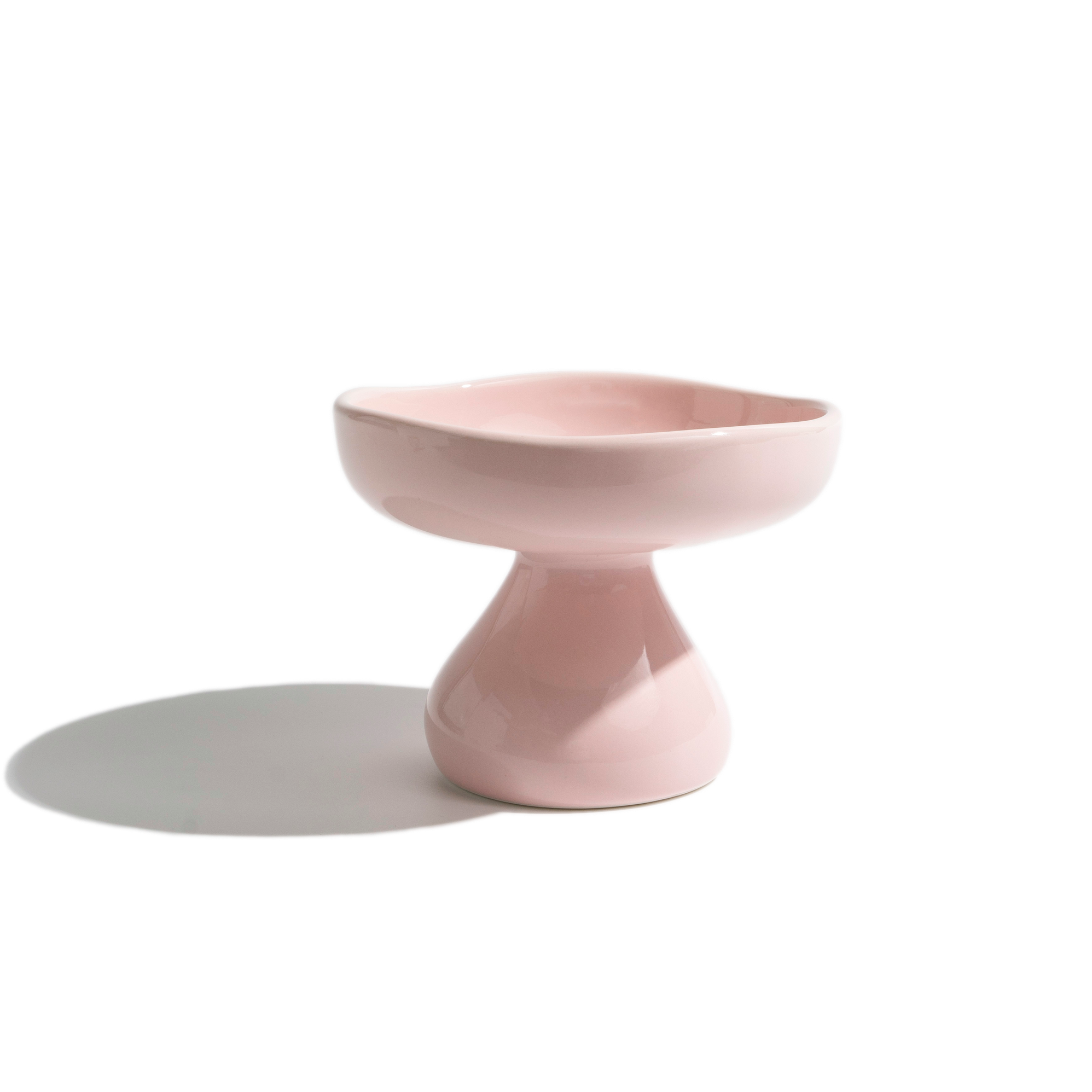 Pink mushroom-shape elevated ceramic cat bowl with a rounded form, ideal for stylish and ergonomic cat feeding.