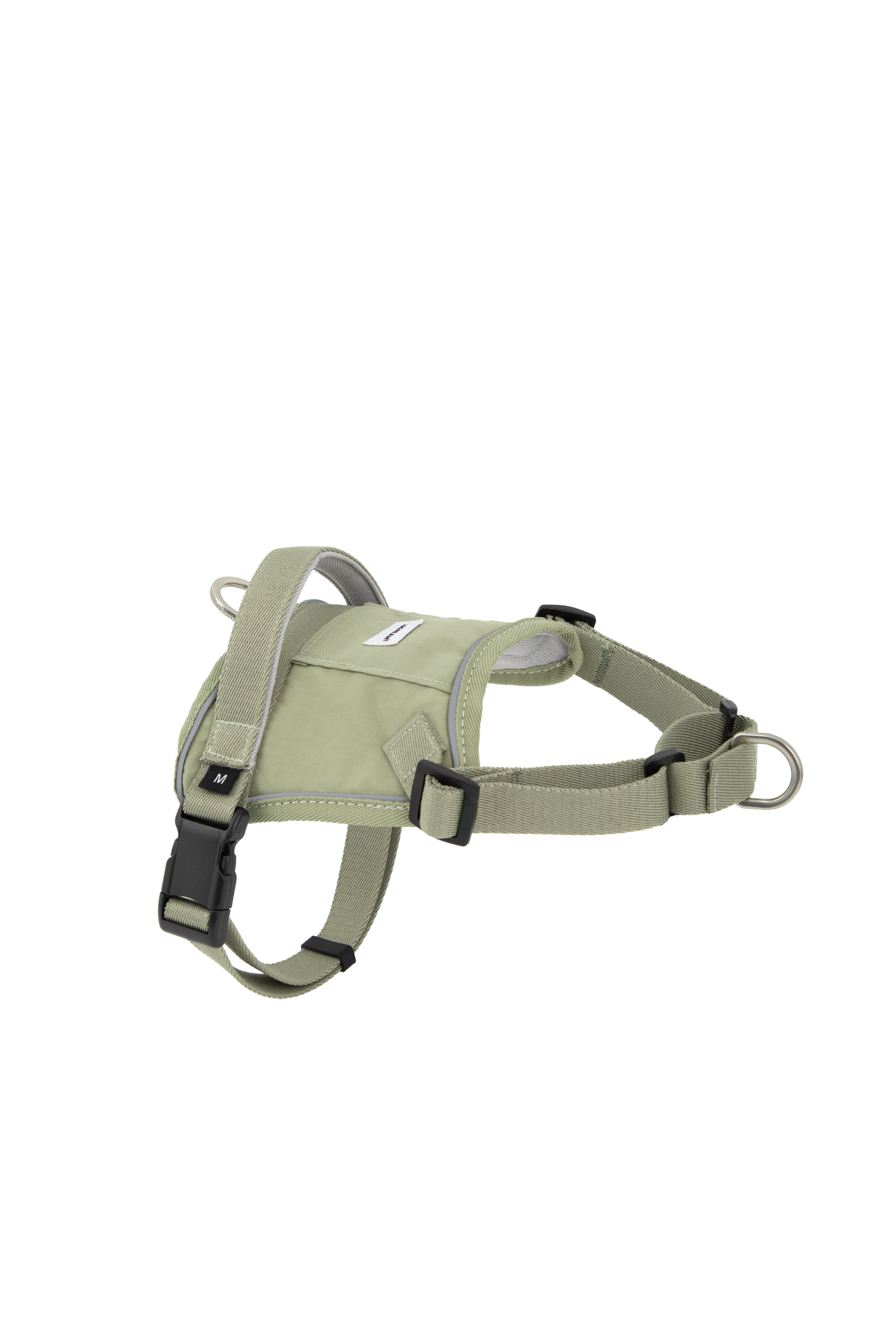 Flat lay of a light green no-pull dog harness highlighting the body panel, adjustable chest and neck straps, and dual leash attachment points.
