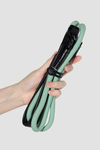 Close-up of nylon rope slip dog leash with leather patch and metal ring, showing material combination for training leash control.
