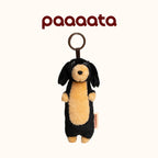 Plush dog toy with a ring on a white background, featuring the brand 'paaaata'.