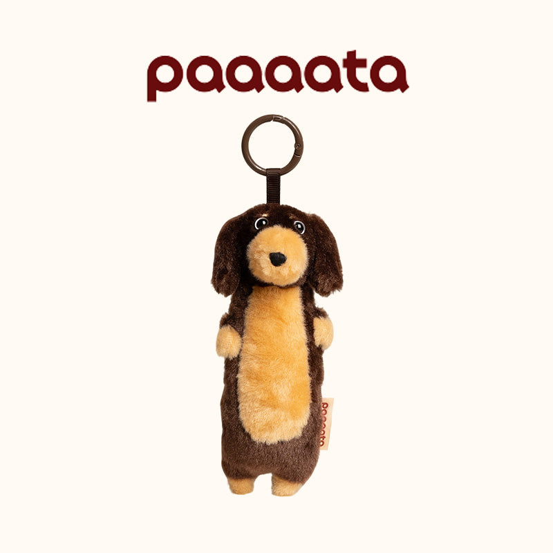 Plush dog toy with a ring on a white background, featuring the brand 'paaaata'.