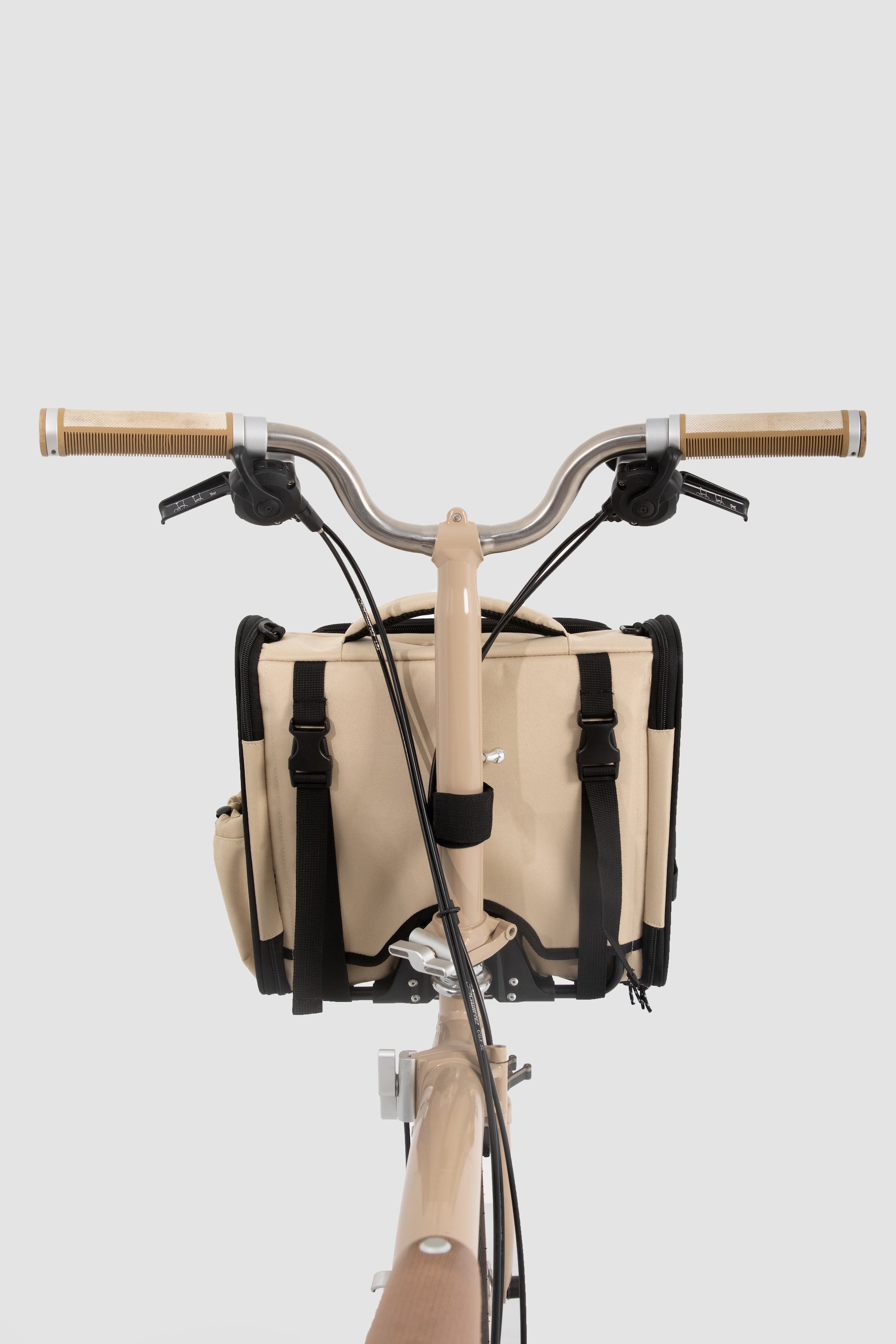 Front view of a pet bike bag installed on the handlebar area, showing the symmetrical front-mount setup on a bicycle.
