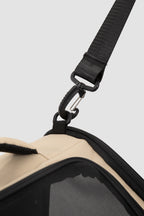 Close-up of the pet bike bag adjustable shoulder strap with clip and D-ring attachment, next to the zipper edge and mesh panel.