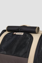 Top view of a pet carrier backpack showing the large ventilated mesh window with roll-up flap, designed for airflow and visibility.
