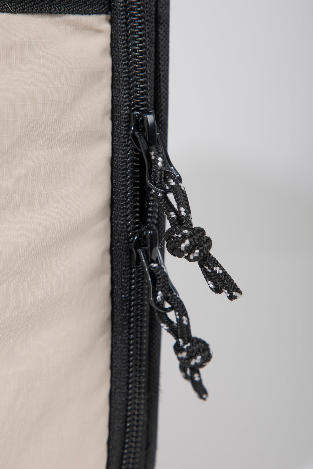 Close-up of the double zipper design on a pet flight carrier, suitable for secure closure and airline tie requirements.