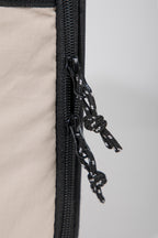 Close-up of the double zipper design on a pet flight carrier, suitable for secure closure and airline tie requirements.
