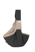 Black pet sling carrier shown alone, displaying the overall shape, shoulder strap, mesh lining, side zipper, and curved pouch design.
