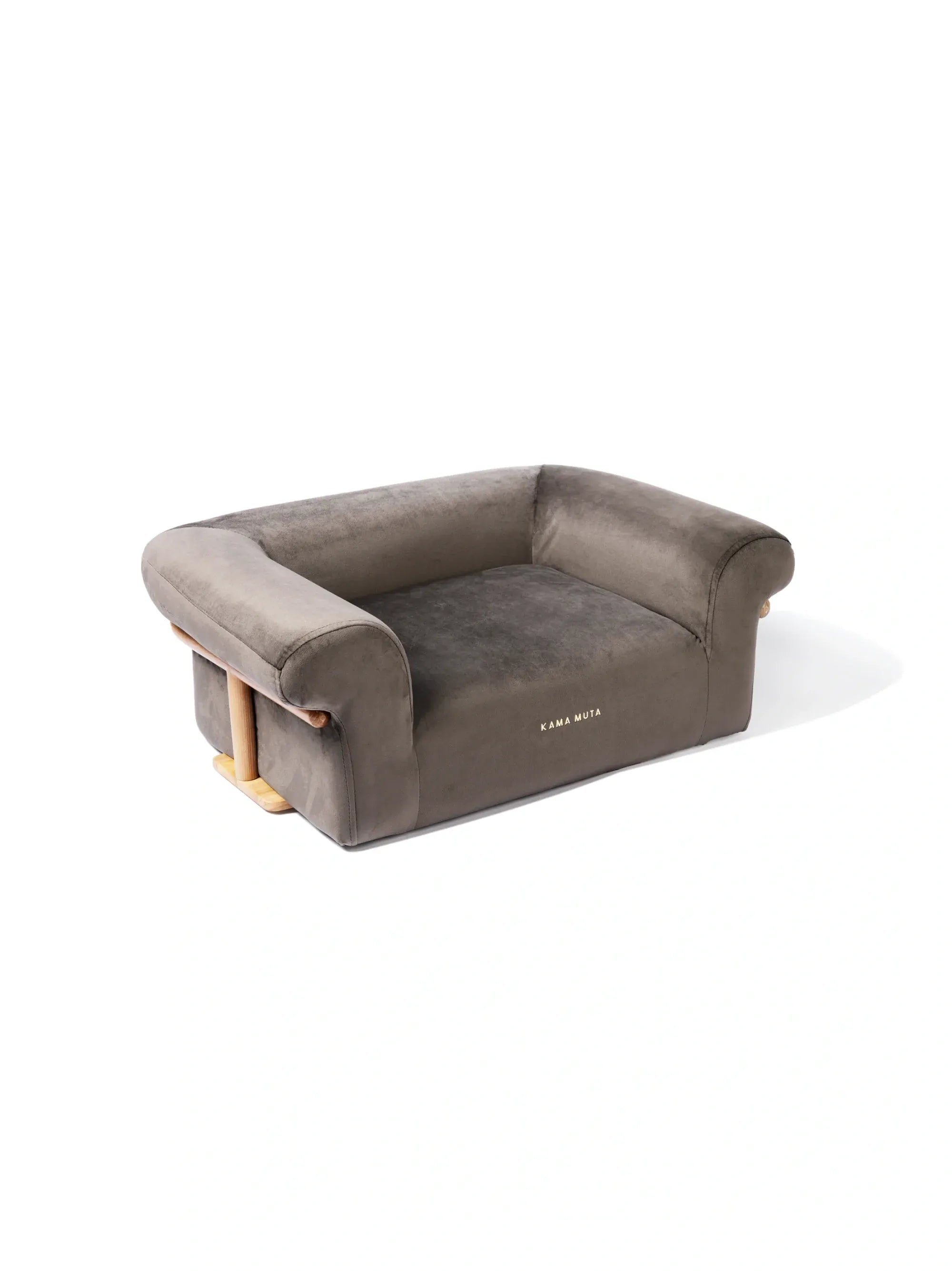 Dark-toned velvet pet sofa on a white background with structured armrests and compact proportions