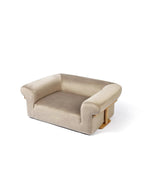 Velvet pet sofa displayed on a white background, featuring a low-profile design and enclosed seating space