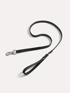 Premium dog leash laid flat to highlight smooth leather texture and balanced length.