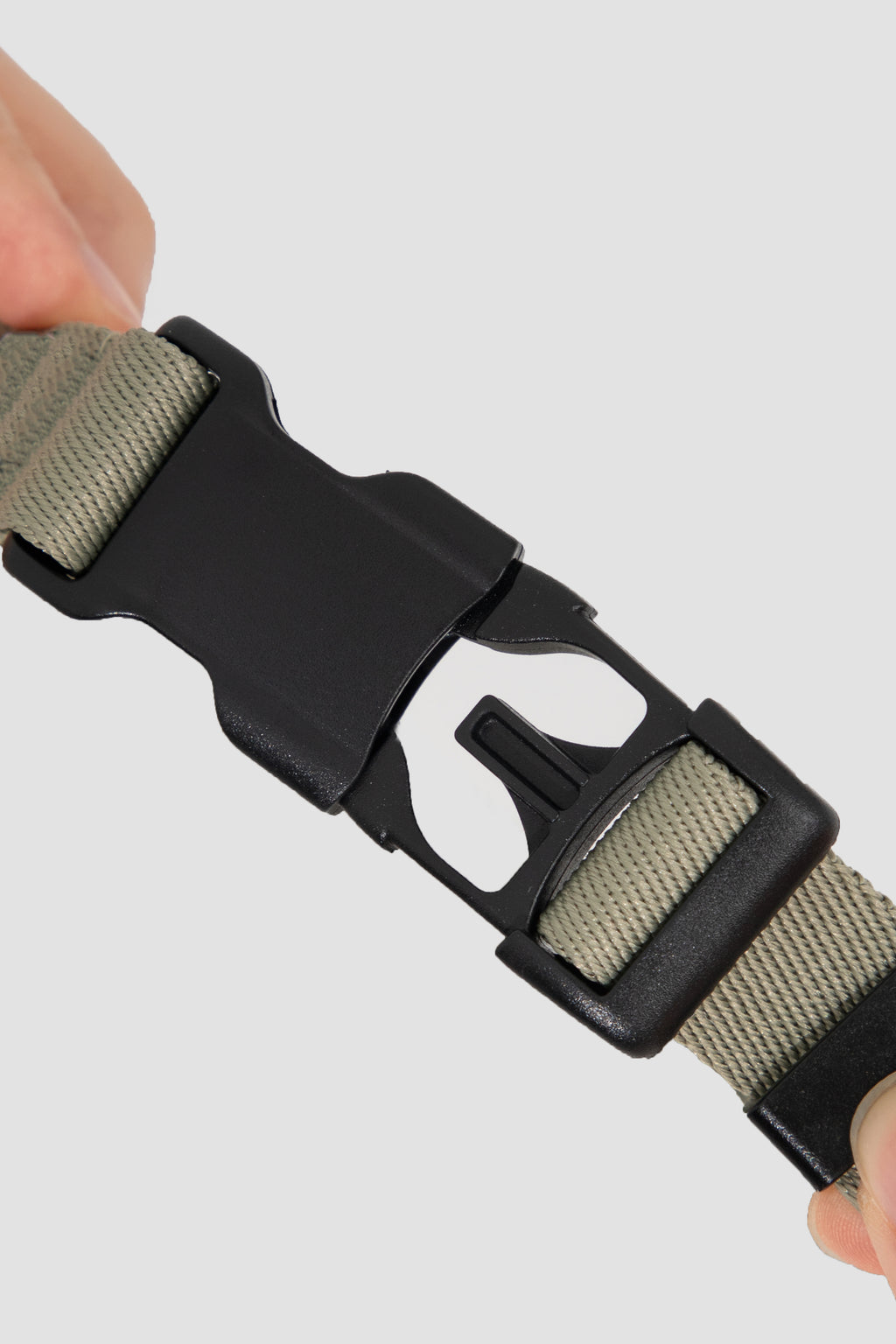  Close-up of the quick-release buckle on the dog harness strap, showing the durable plastic buckle and adjustable webbing for fast on-and-off wear.