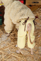 Close-up of reversible dog jacket showing adjustable back drawstring and tail opening for a secure winter fit