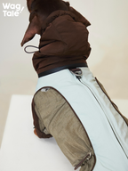 Back detail of the Snowy Forest 2.0 winter dog suit showing the built-in leash ring and reinforced back panel; practical design for cold weather walks without removing the suit.