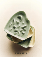 Stacked green and cream KAMA MUTA slow feeder bowls (space-saving pet dining ware)
