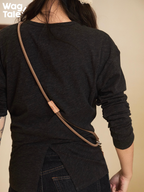 Vintage-style crossbody dog leash worn across the back, highlighting soft matte rope texture, adjustable length, and understated everyday aesthetic.