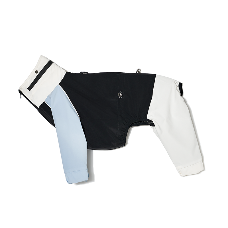 Flat lay of a waterproof dog raincoat featuring contrast panels and full-leg coverage
