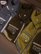 Flat lay of insulated winter dog vests in multiple colors, highlighting padded design, back zipper structure, and removable patch details.