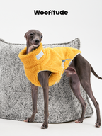 Bedlington Terrier walking in a yellow lamb fleece dog vest, showing ease of movement and breathable structure.